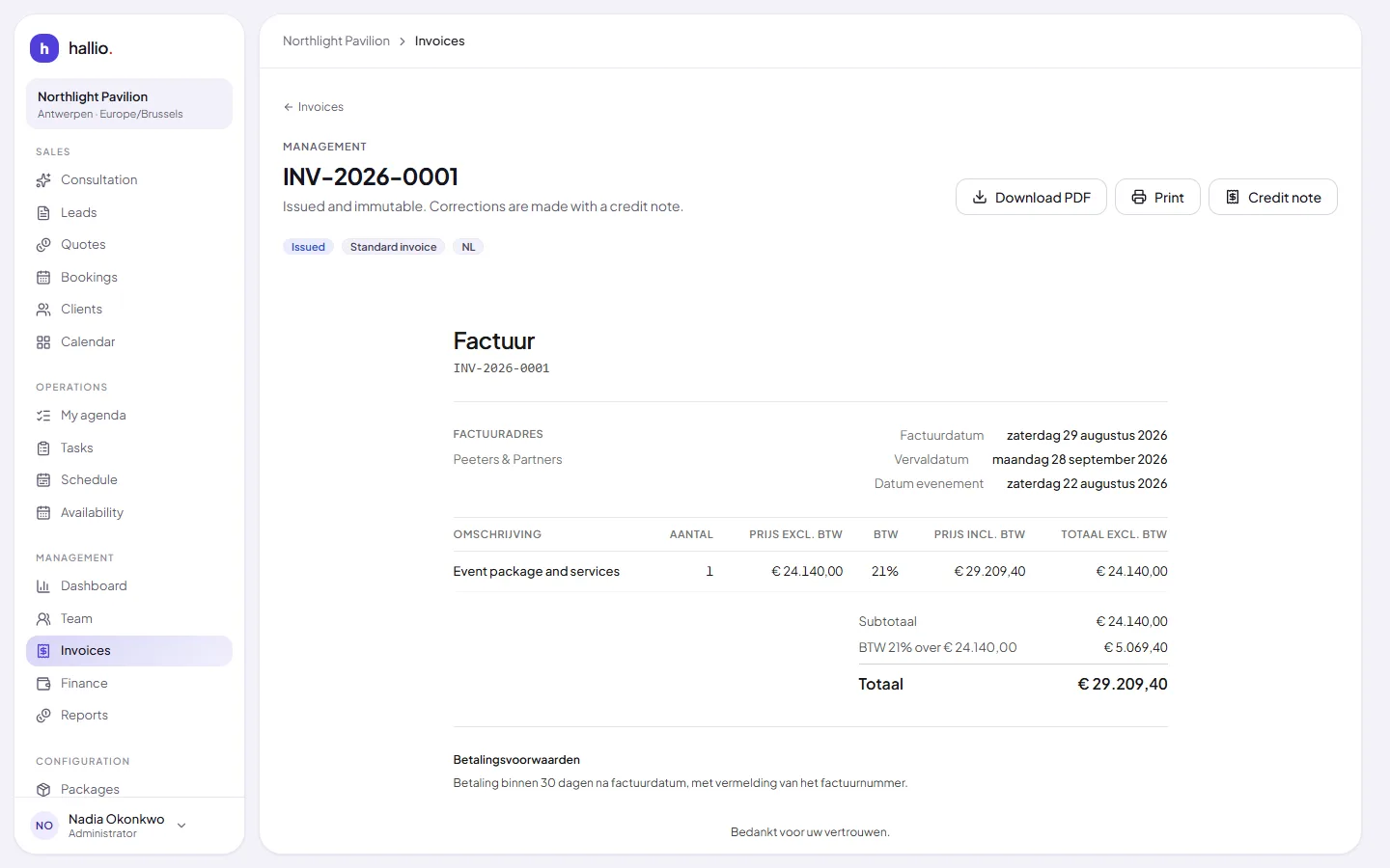 An issued invoice carrying its sequential reference, VAT lines and payment terms, written in the client's language.
